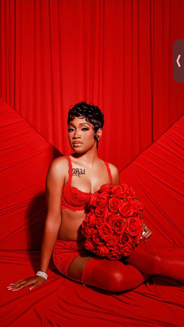 Editorial shot — sculpted curly pixie, red on red